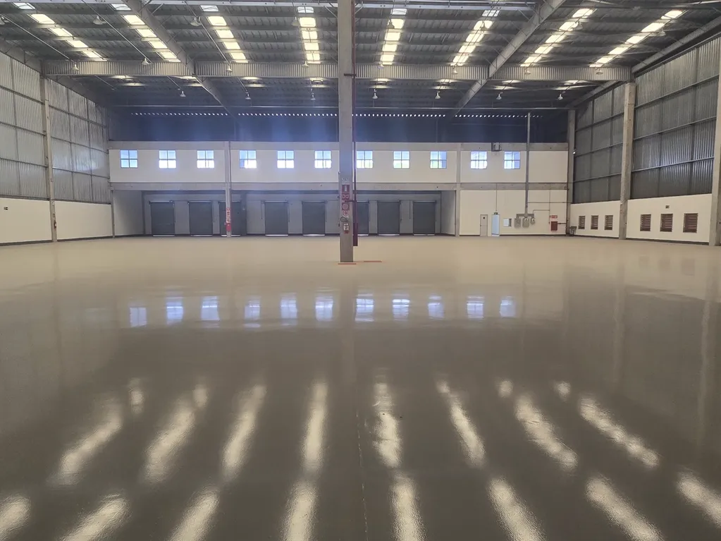 Warehouse interior with polished floor and loading doors
